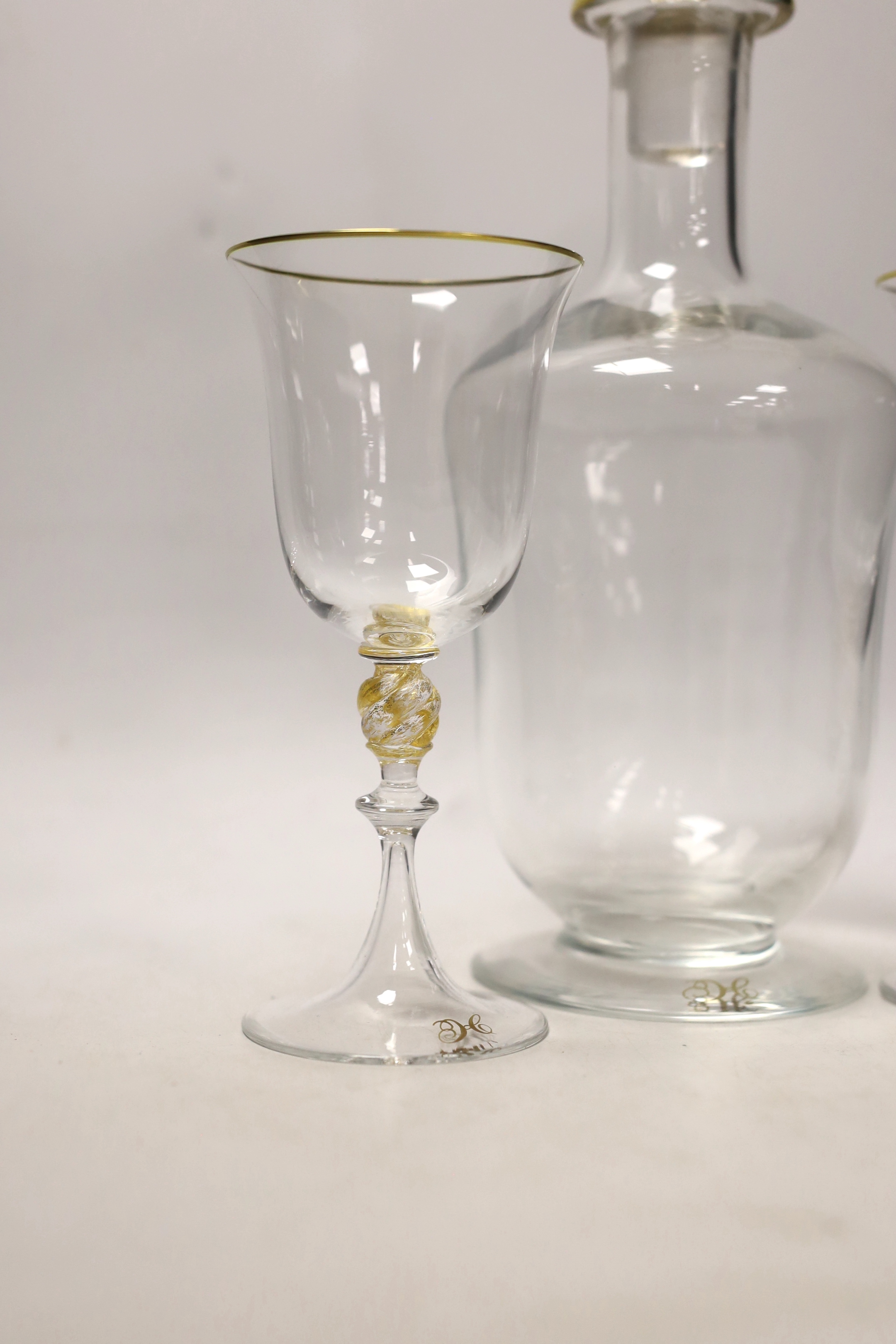 A Venetian glass decanter and two matching glasses, each with a gilt ‘H’ to foot. Tallest 32cm